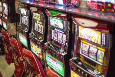 Book of Dead gameplay showing expanding wild symbols and payline wins